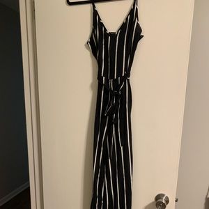 Black and white striped jumpsuit with waist tie